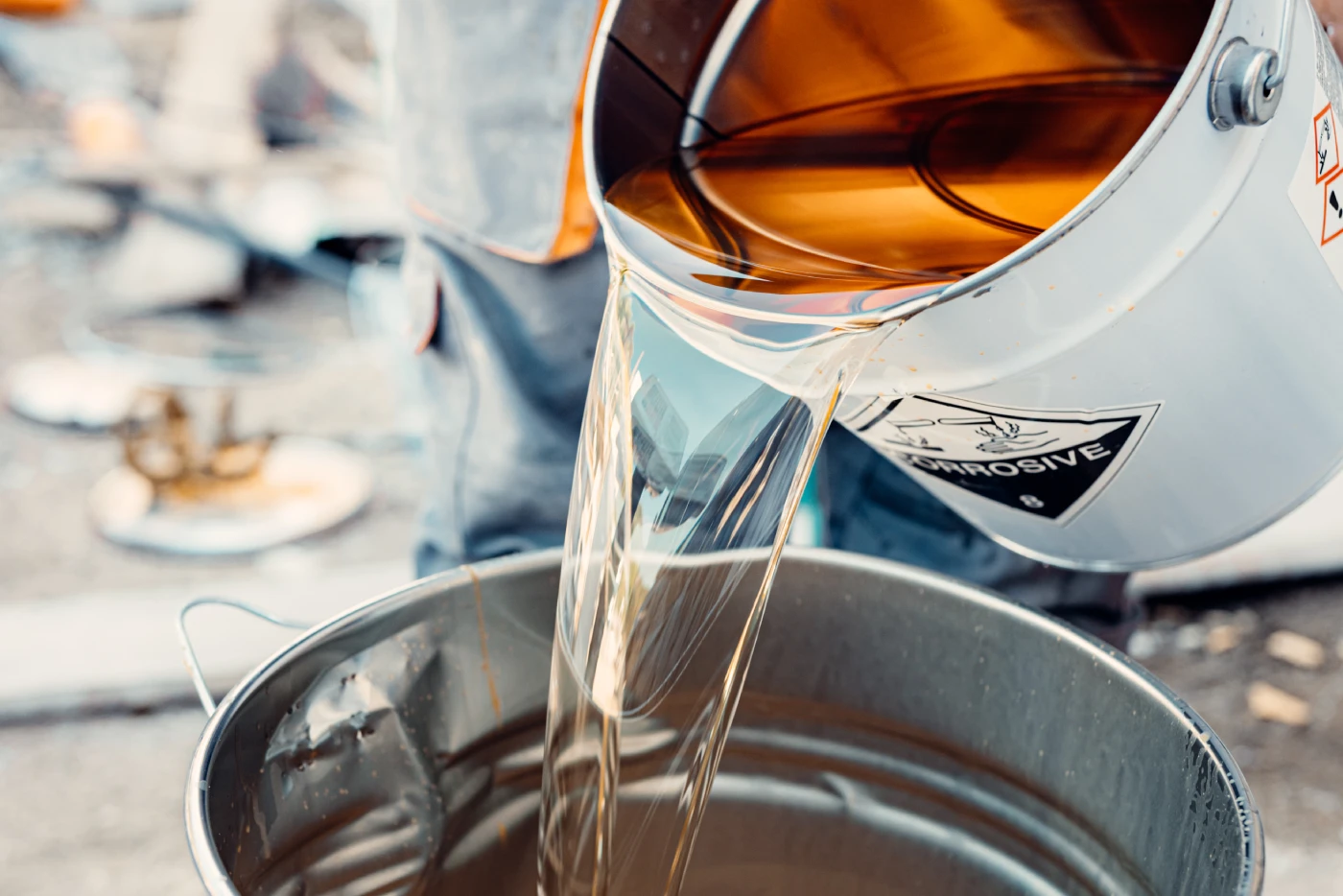 pouring-liquid-into-a-metal-container
